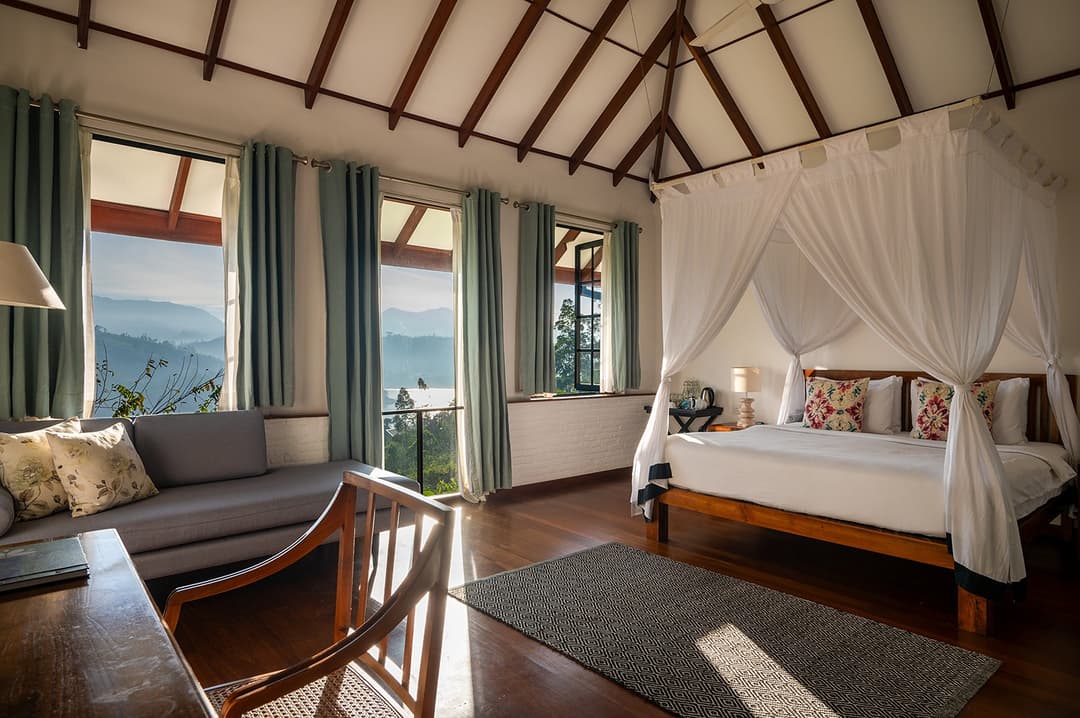 Norton lakeview bedroom with canopy bed and valley views at Camellia Hills, Dickoya