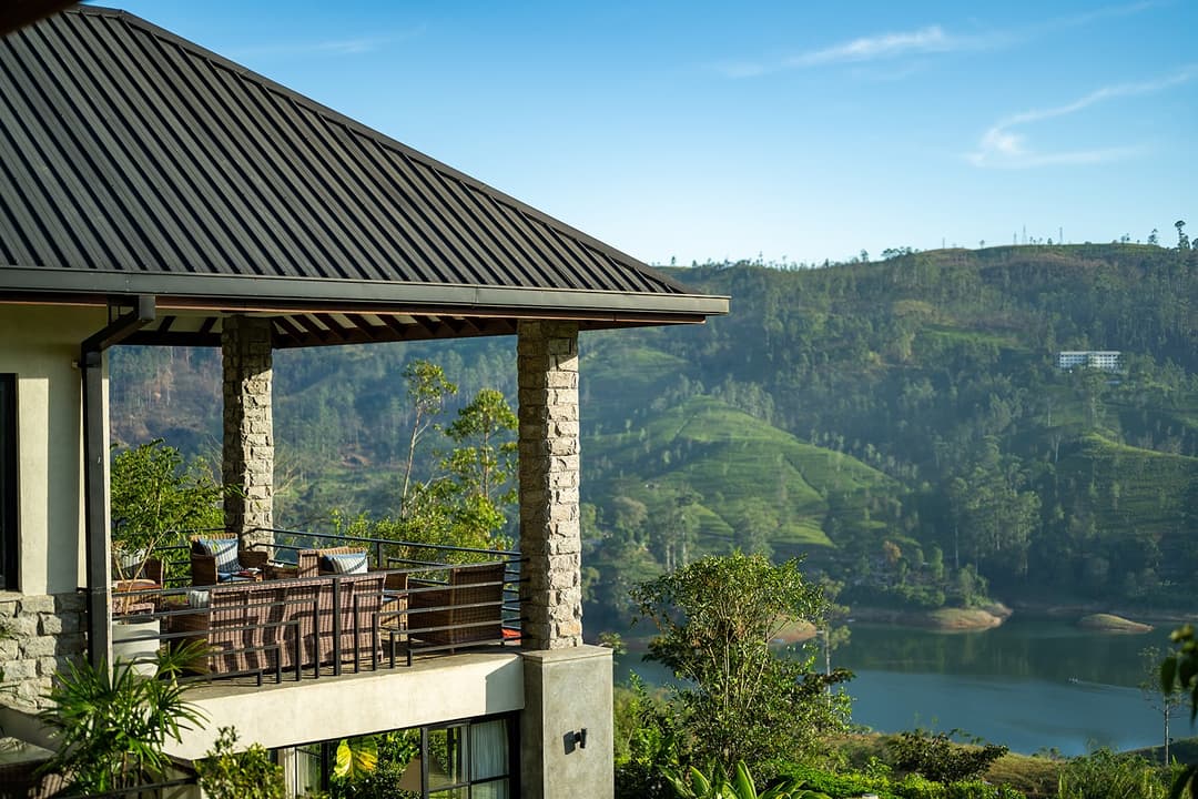Open veranda pavilion with Castlereagh Reservoir below at Camellia Hills, Dickoya