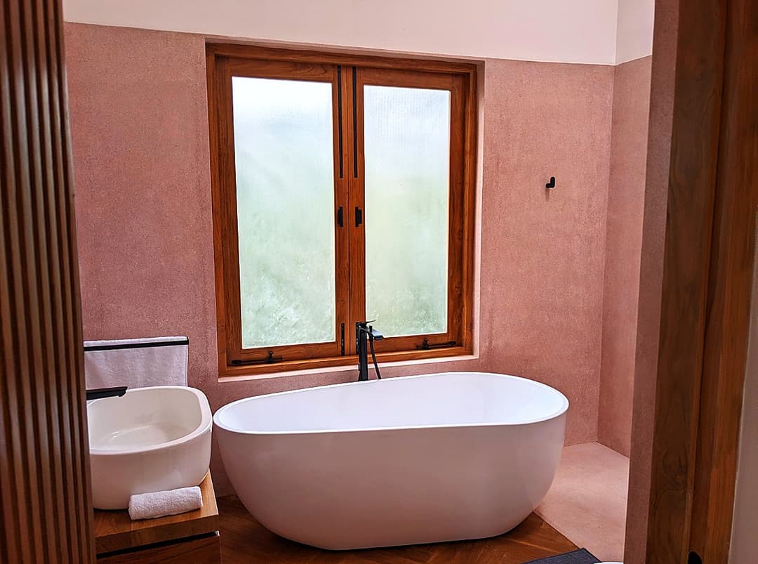 Pink bathroom with freestanding bathtub at Salt and Stone, Ahangama, Sri Lanka