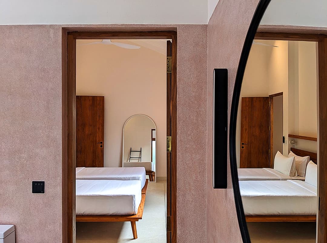 Timber door opening to bedroom corridor at Salt and Stone, Ahangama, Sri Lanka