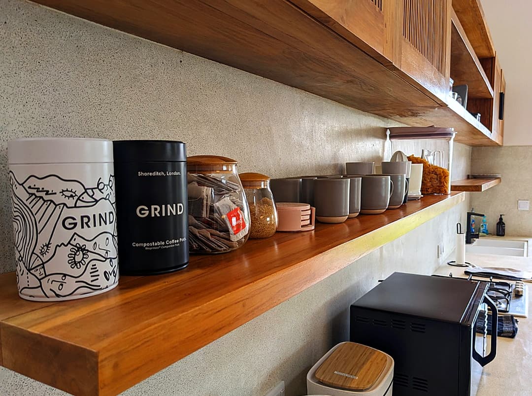 Kitchen counter with coffee equipment and timber shelving at Salt and Stone, Ahangama