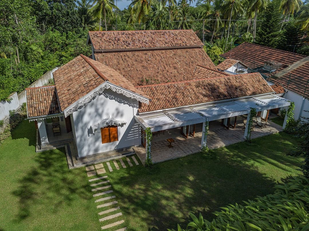 Aerial of Island Villa Ahangama main walauwa with coconut palms, Ahangama, Sri Lanka