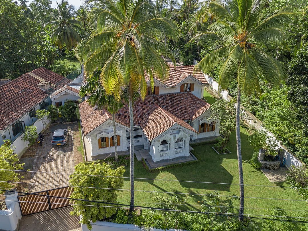 Close aerial of Island Villa Ahangama main house tiled roof and garden, Ahangama, Sri Lanka