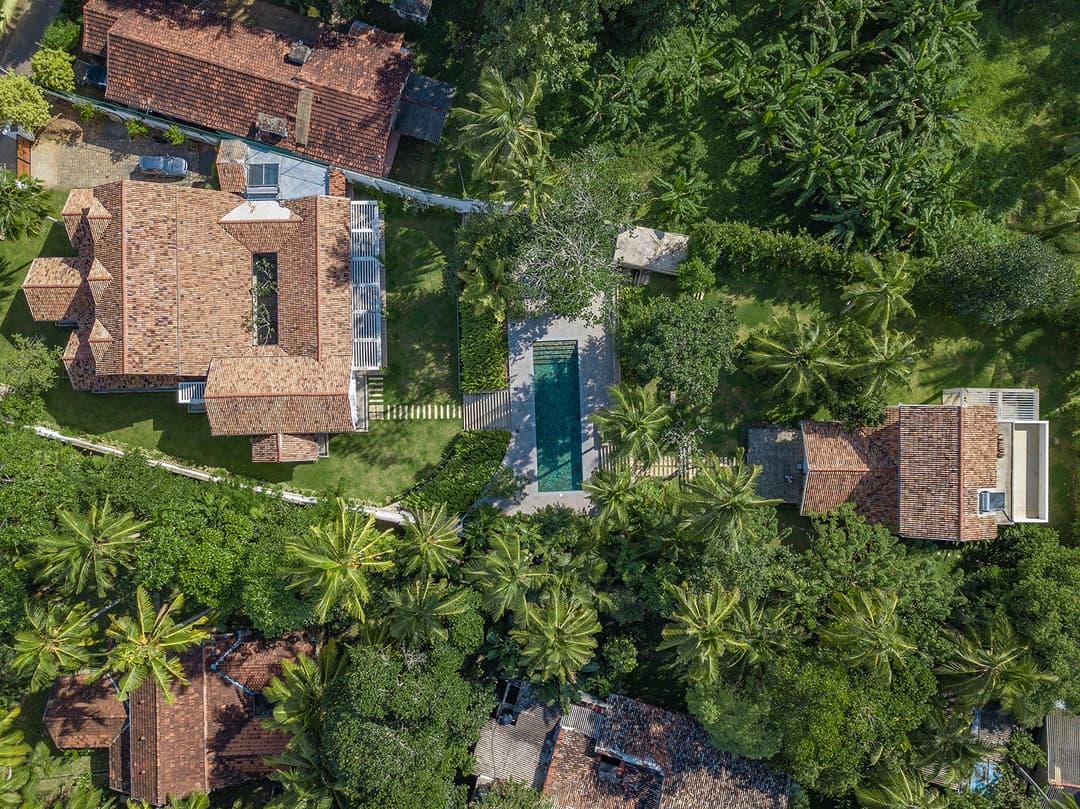 Aerial overview of Island Villa Ahangama pool and both houses in tropical garden, Ahangama