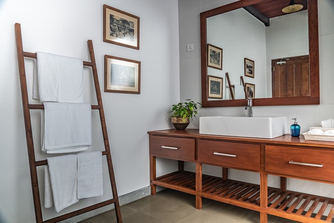 Bathroom with teak vanity and towel ladder at Island Villa Ahangama, Ahangama, Sri Lanka