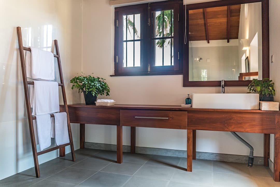Bedroom writing desk with louvred shutters at Island Villa Ahangama, Ahangama, Sri Lanka