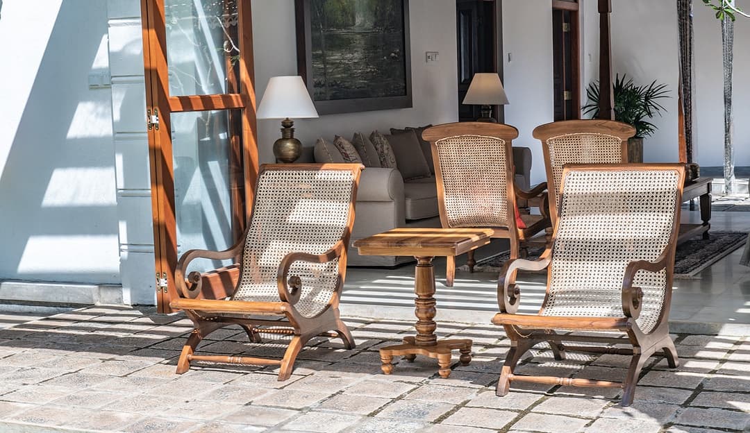 Covered veranda with plantation chairs at Island Villa Ahangama, Ahangama, Sri Lanka