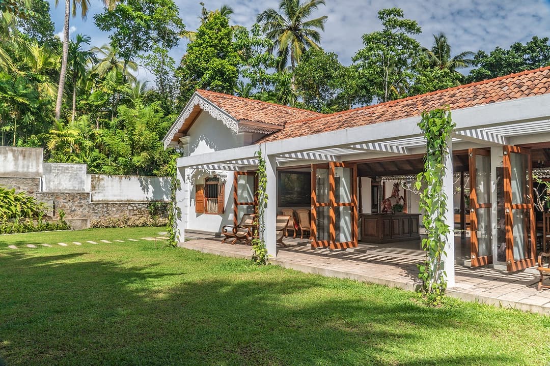 Island Villa Ahangama garden house exterior facade with white walls and tiled roof, Ahangama