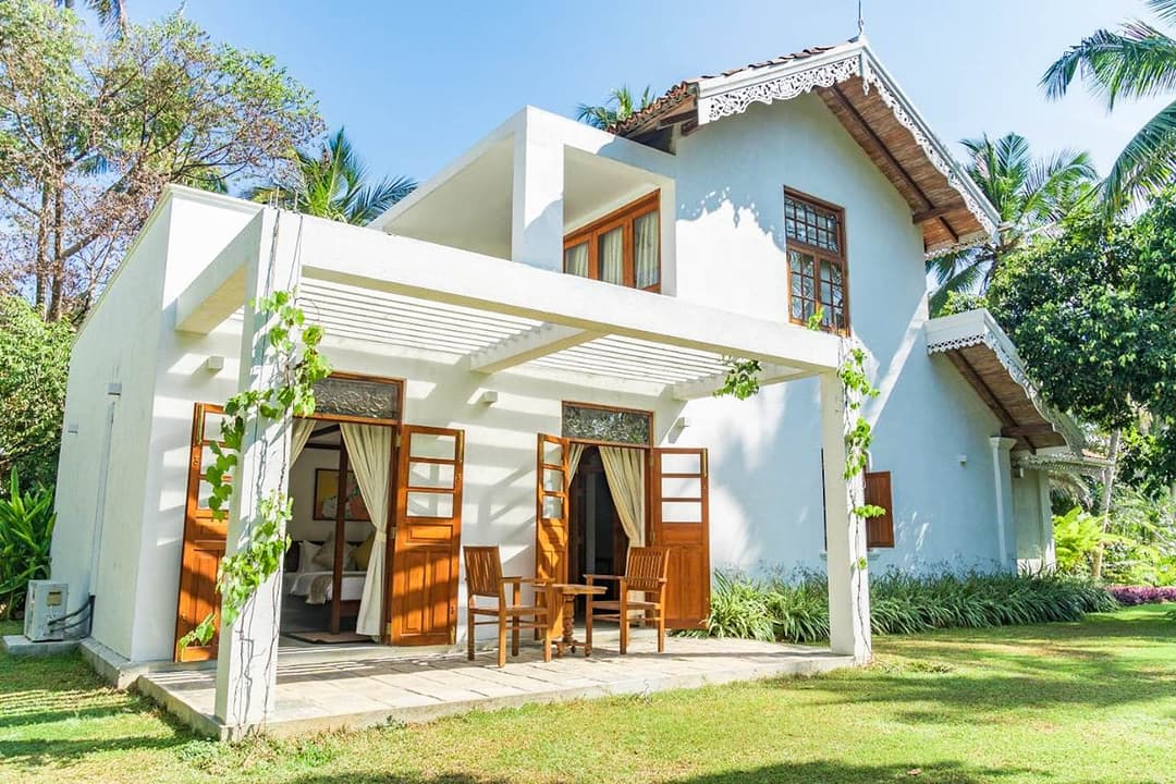 Island Villa Ahangama garden house exterior with tropical garden and lawn, Ahangama, Sri Lanka