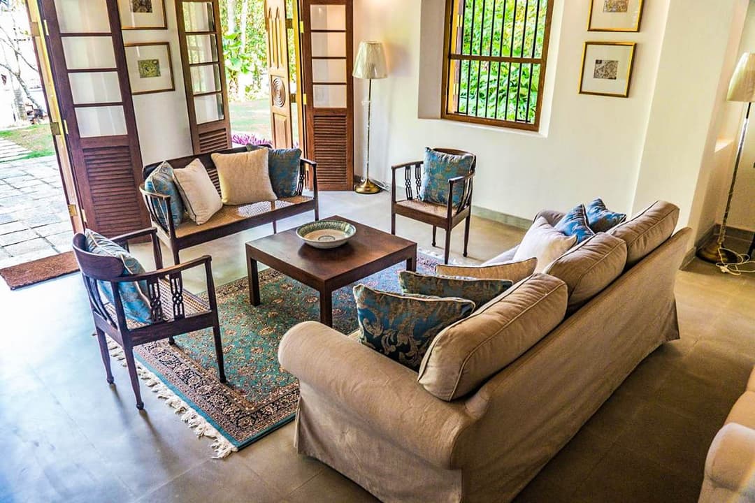 Garden house lounge with sofas and colonial furniture at Island Villa Ahangama, Ahangama