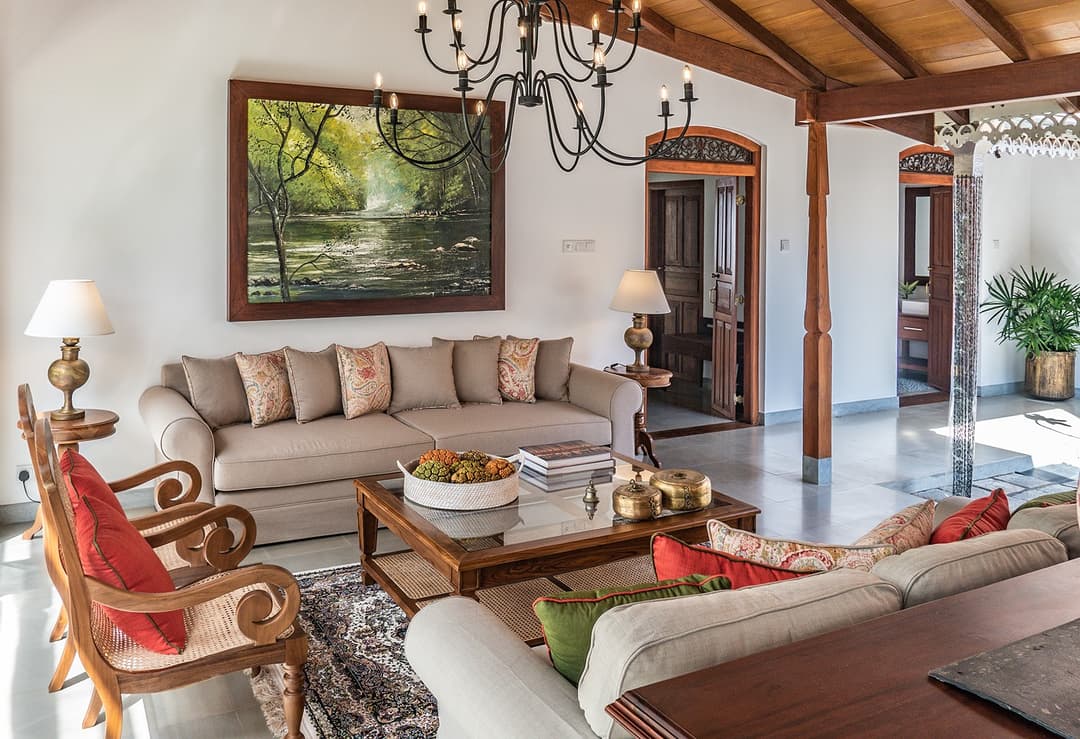 Wide lounge with colonial seating and dining room beyond at Island Villa Ahangama