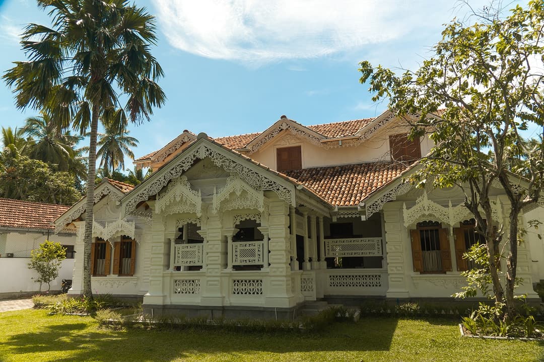 Island Villa Ahangama main walauwa exterior with ornate Sinhalese fretwork eaves, Ahangama