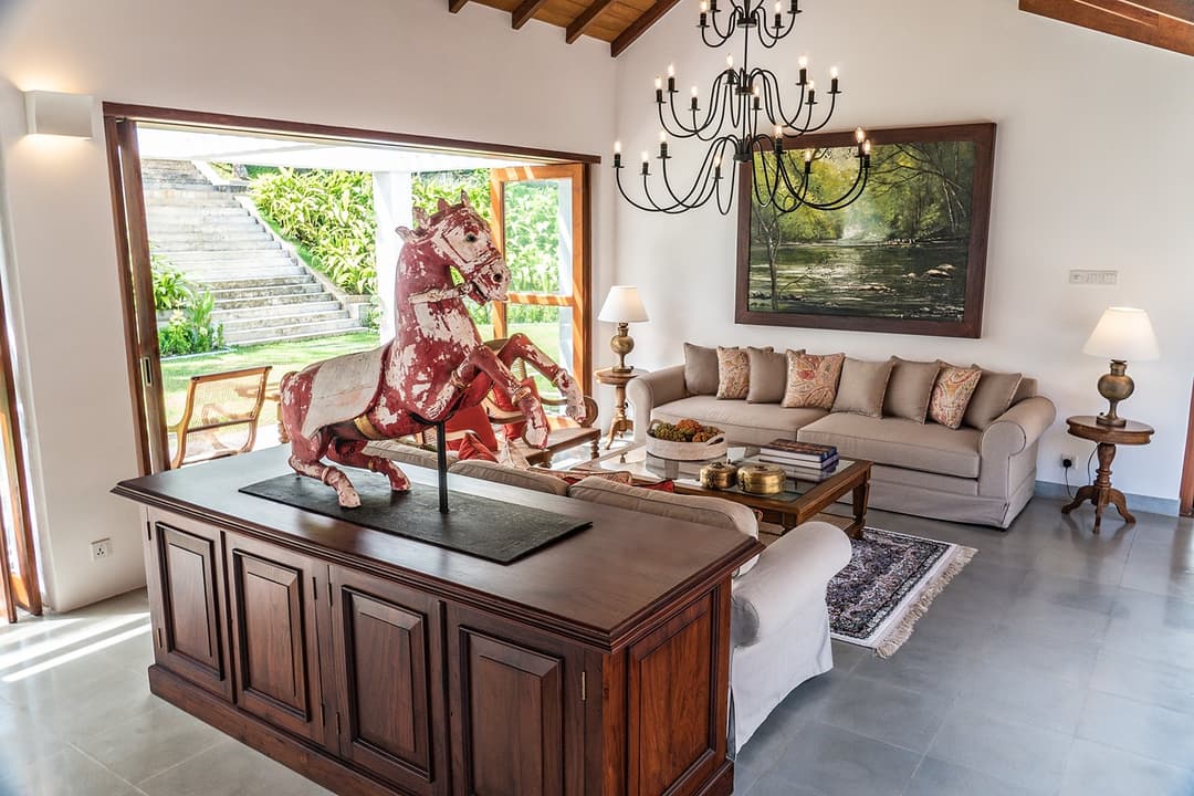 Open-plan lounge and dining with chandelier at Island Villa Ahangama, Ahangama, Sri Lanka