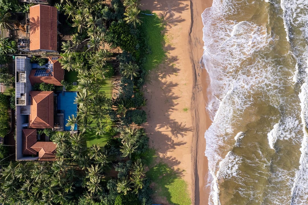Kirana Villa Bentota aerial overhead view showing pool and Bentota beach, Sri Lanka