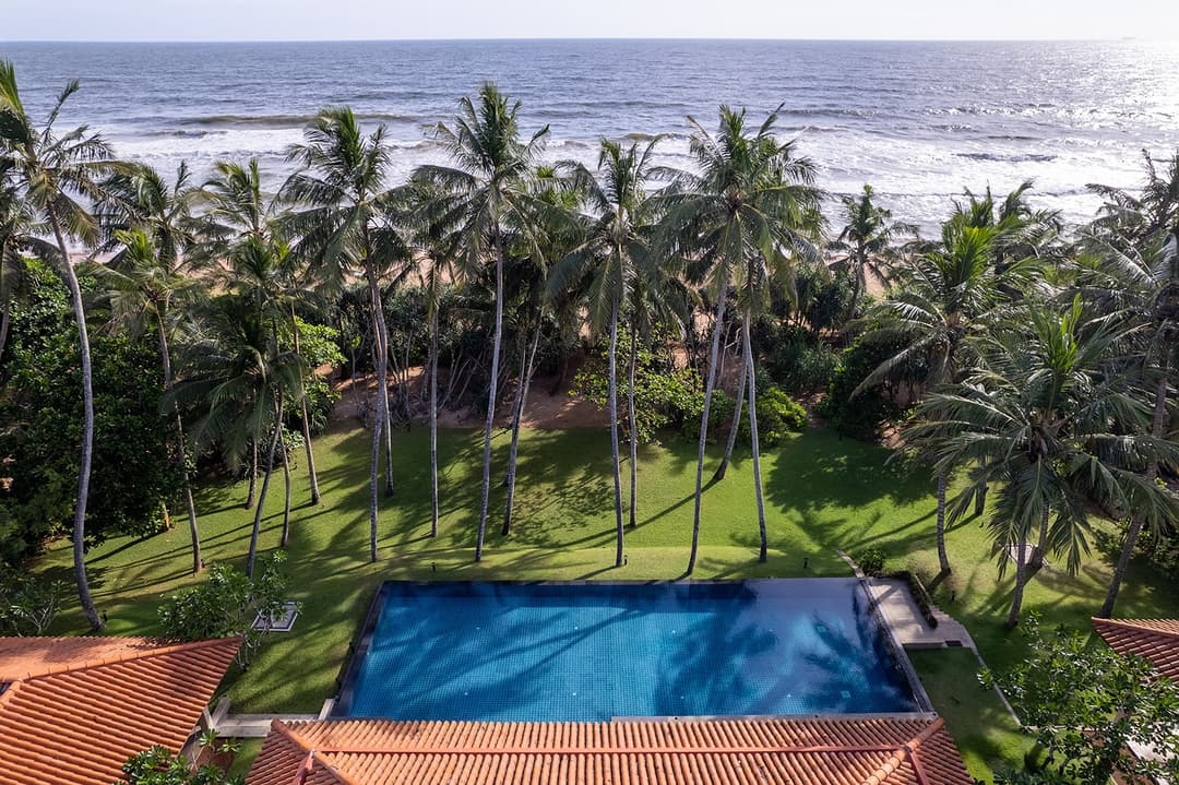 Aerial view of Kirana Villa Bentota pool, garden and Indian Ocean beyond, Sri Lanka