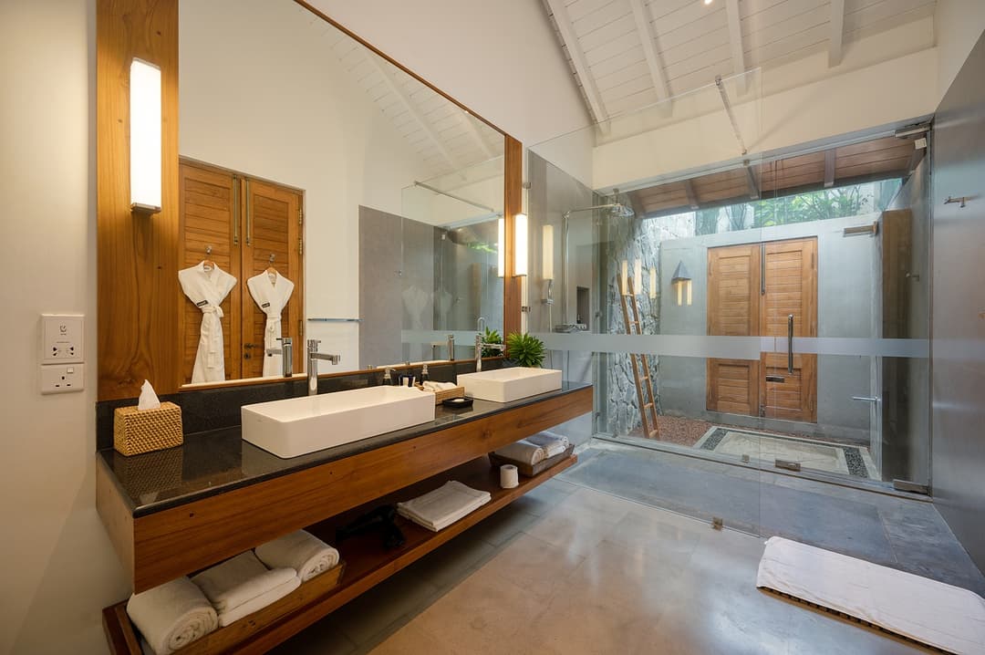 Bathroom with twin vanity and glass shower at Kirana Villa, Bentota, Sri Lanka