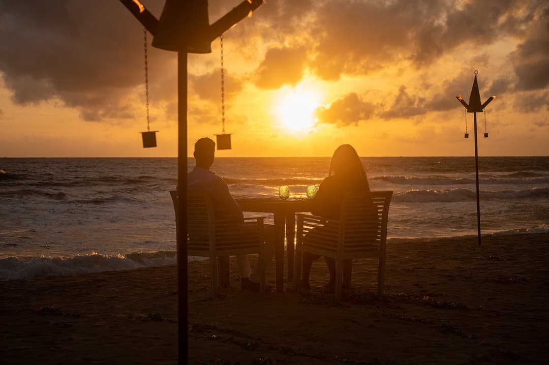 Beach sunset with swing at golden hour from Kirana Villa, Bentota, Sri Lanka