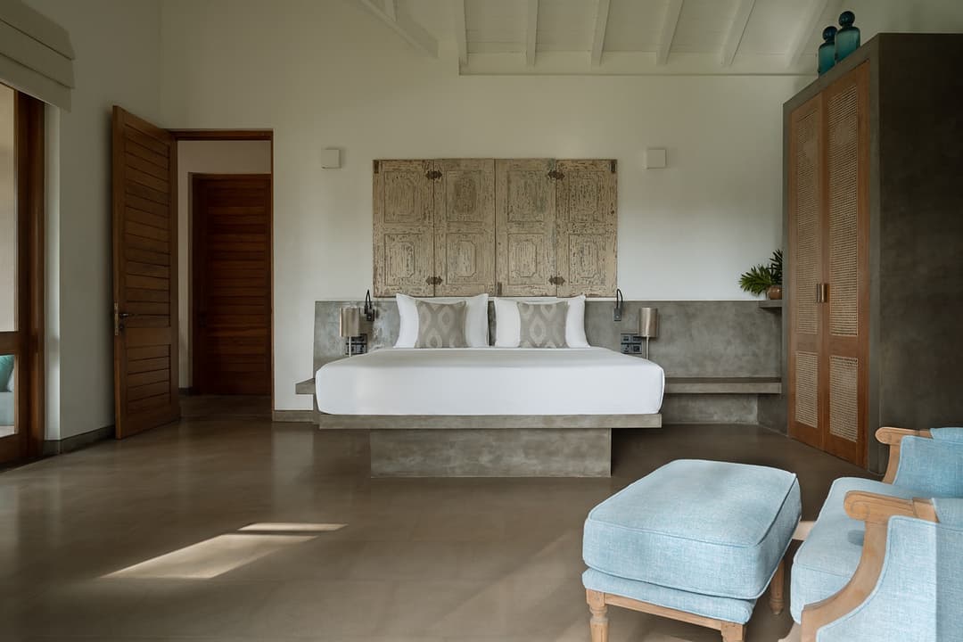King bedroom with blue stool from second angle at Kirana Villa, Bentota, Sri Lanka