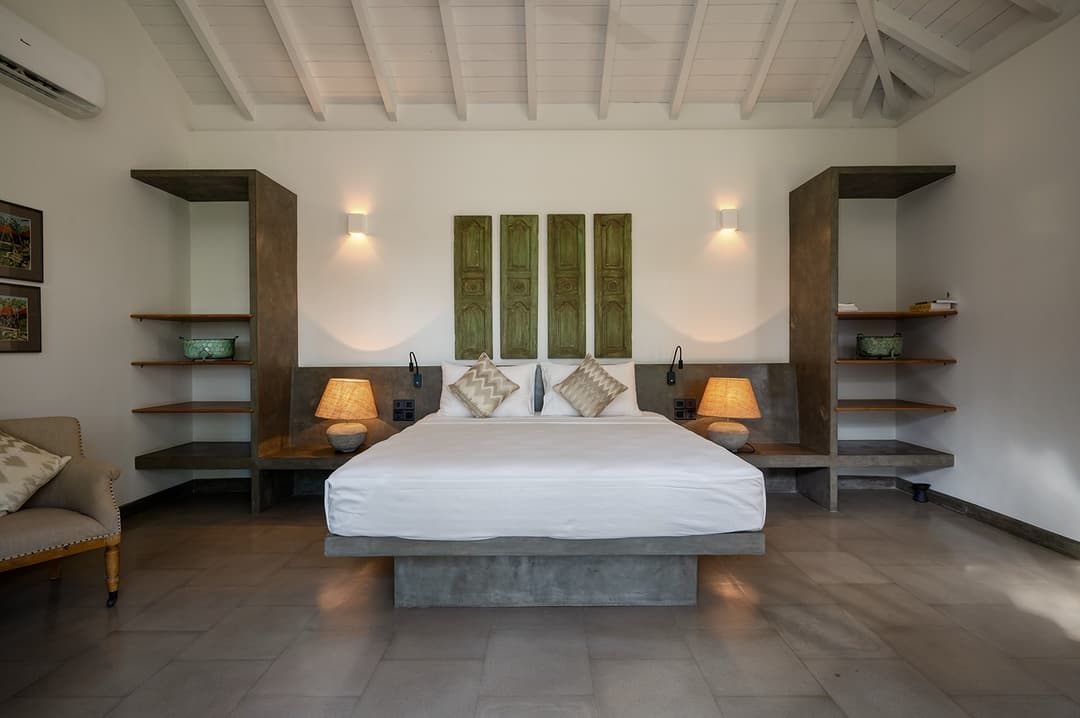 King bedroom with built-in shelving above headboard at Kirana Villa, Bentota, Sri Lanka