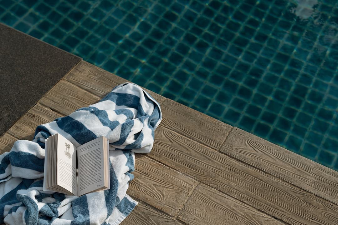 Pool edge detail with rolled towel at Kirana Villa, Bentota, Sri Lanka