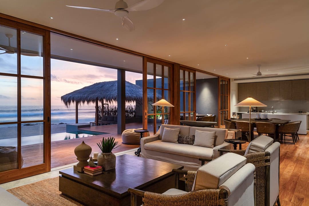 The Six Weligama living room in golden hour warm light, Midigama, Sri Lanka