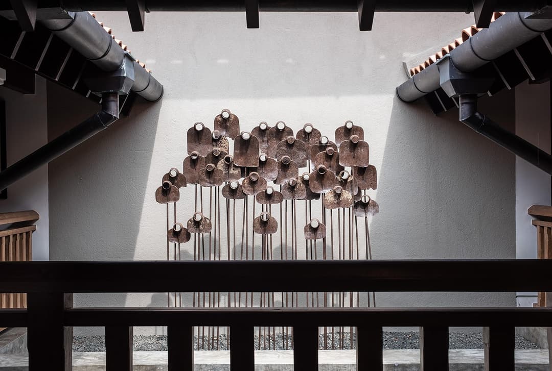 Overhead view of metal flower sculpture installation from mezzanine, No. 77 Leyn Baan