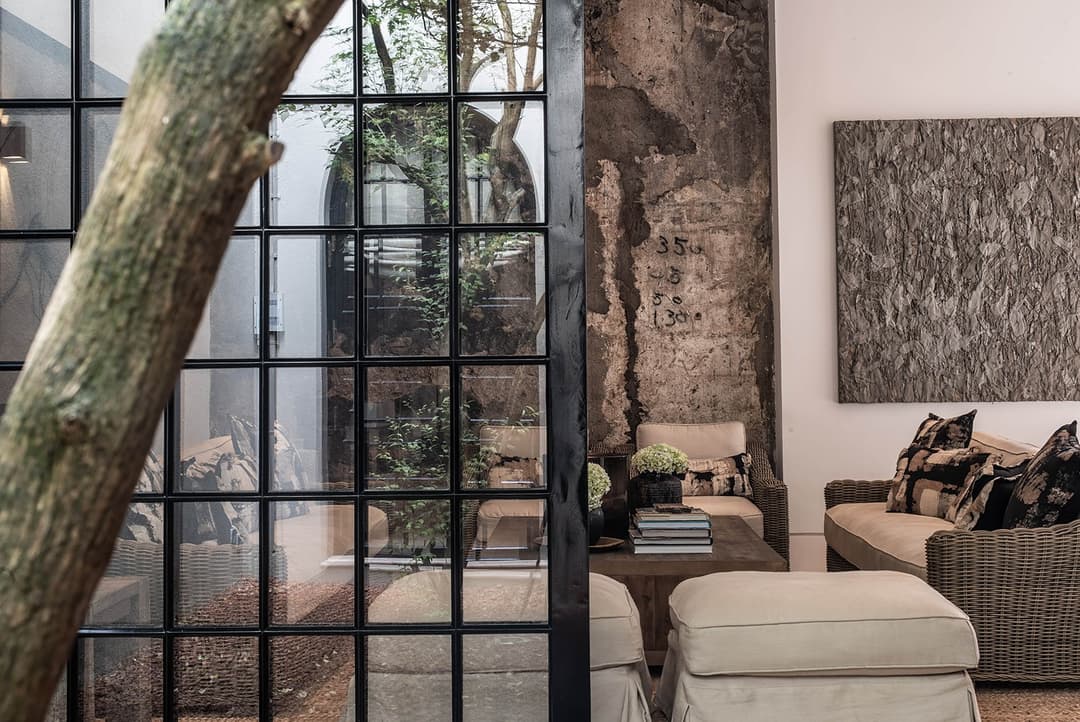 Lounge with tree growing through floor and ceiling, No. 77 Leyn Baan, Galle Fort, Sri Lanka