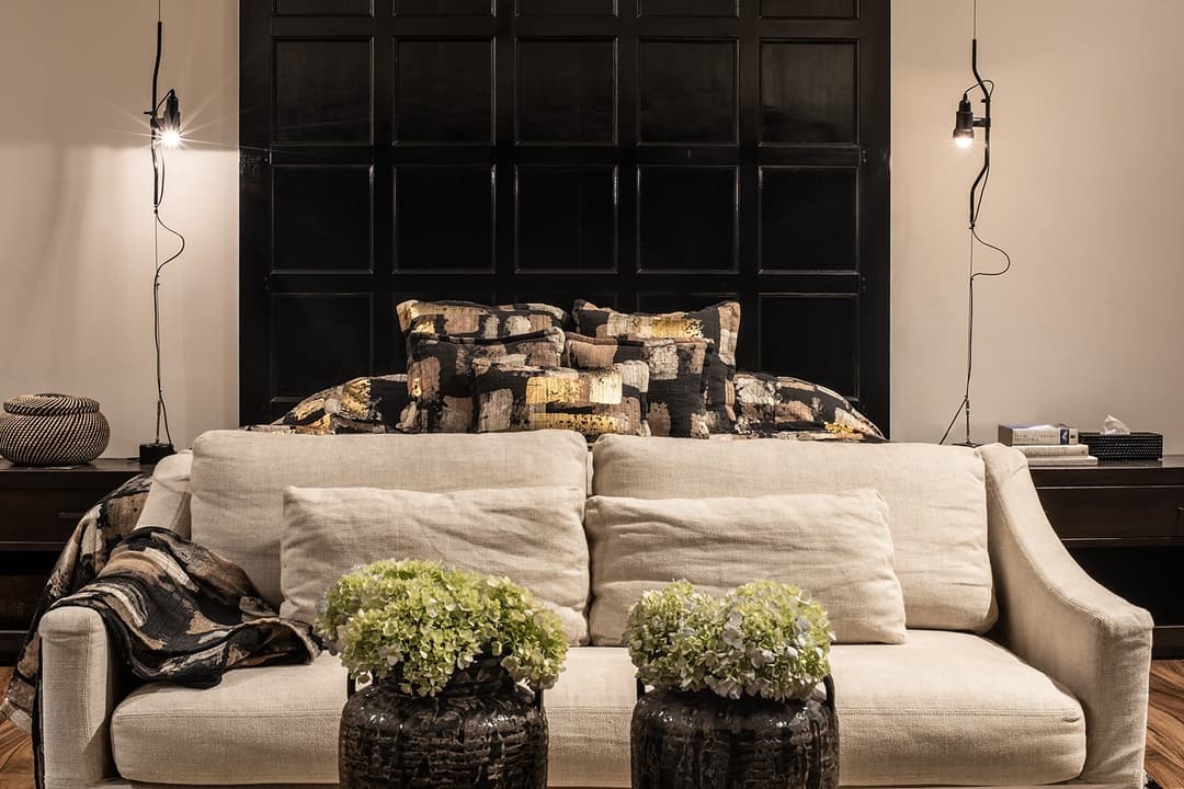 Lounge with cream sofas and plants in dark interior, No. 77 Leyn Baan, Galle Fort