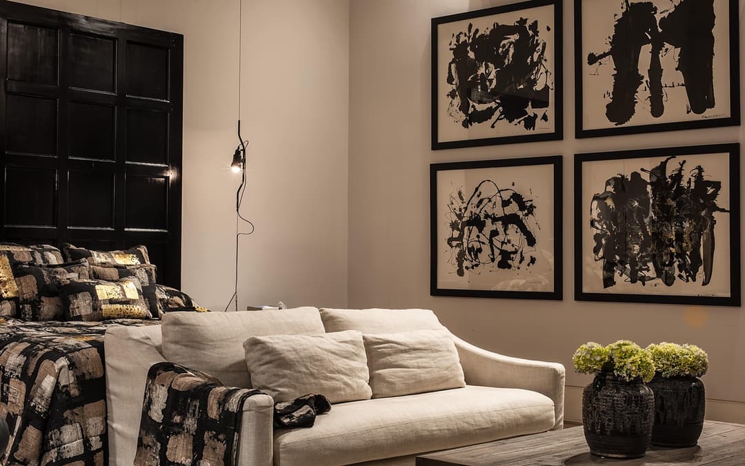Lounge with cream sofa and black framed art panels, No. 77 Leyn Baan, Galle Fort, Sri Lanka