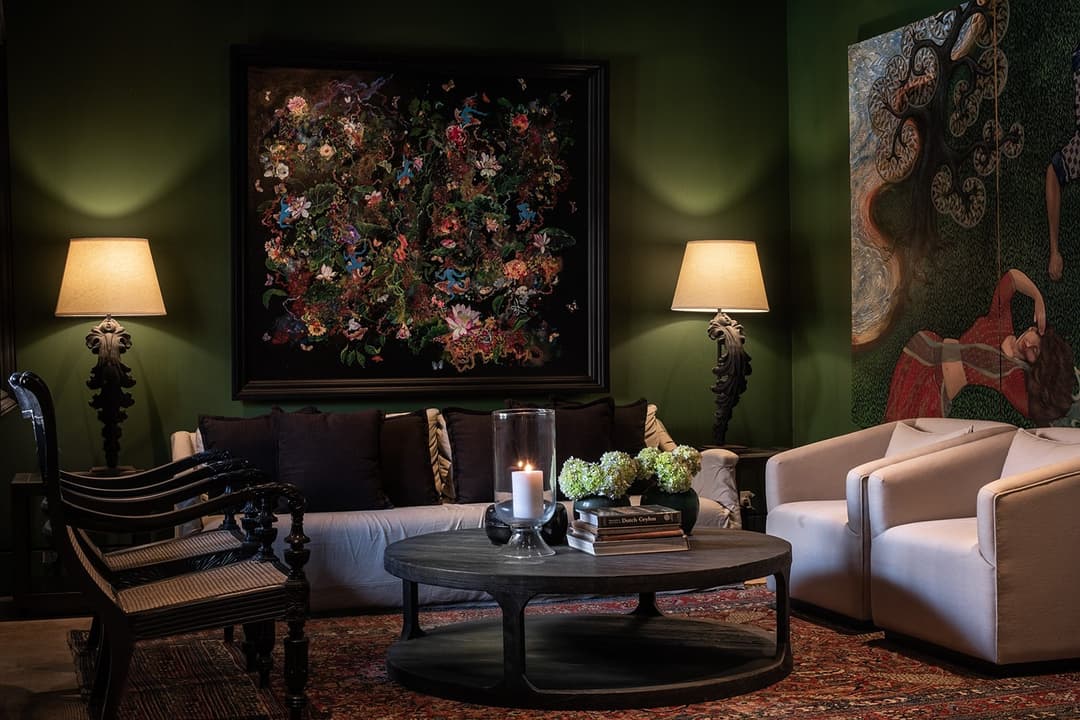 Formal living room with green wall, floral painting and cream chairs, No. 77 Leyn Baan Galle
