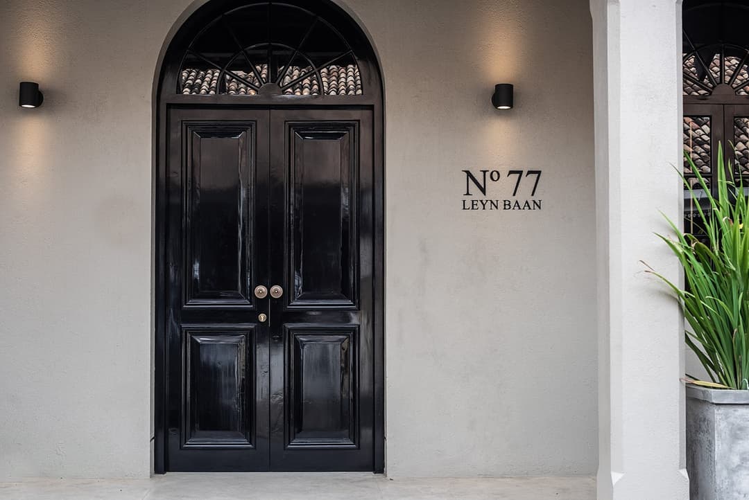 No. 77 Leyn Baan entrance with navy blue double door and number sign, Galle Fort, Sri Lanka