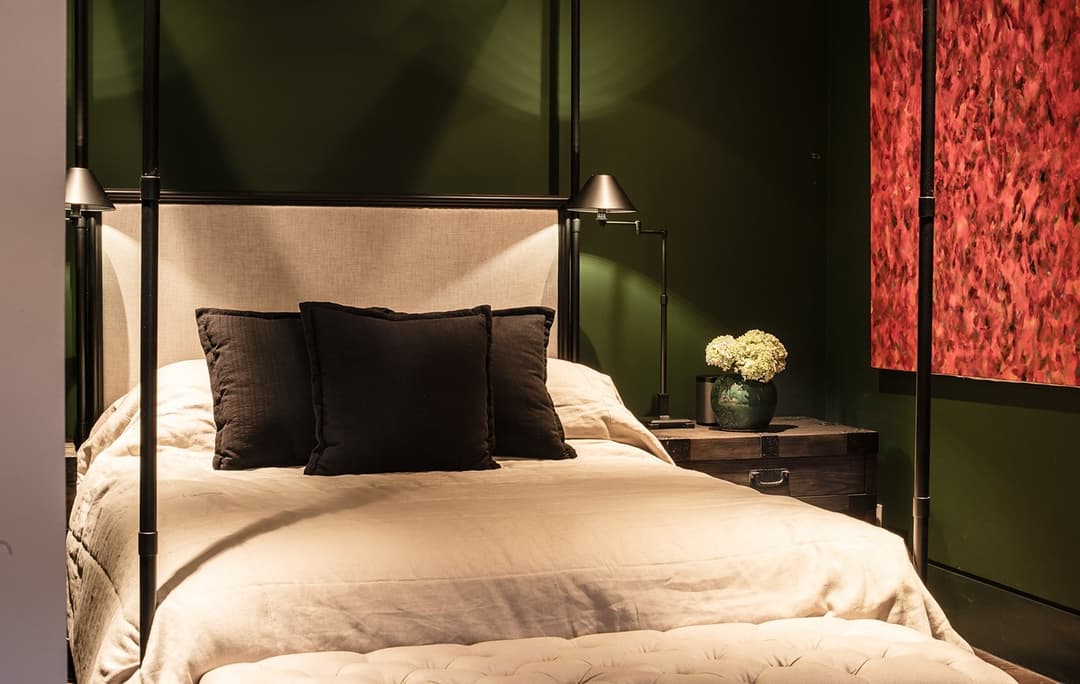 Bedroom with green headboard, painting and red carpet, No. 77 Leyn Baan, Galle Fort