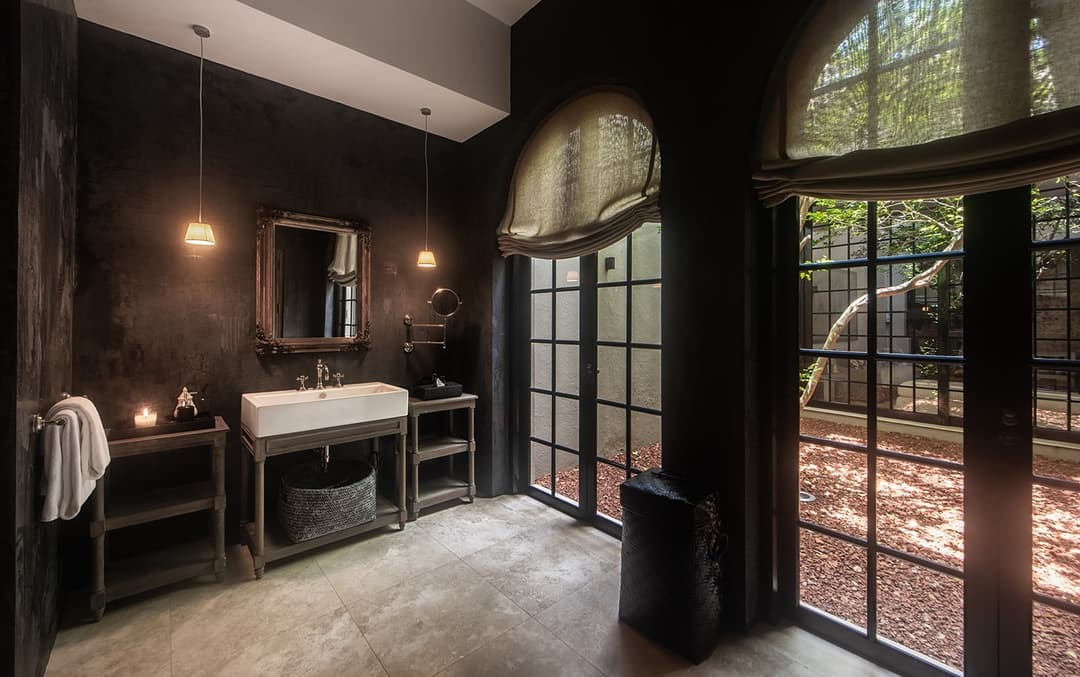 Bathroom with steel frame window and towel bench, No. 77 Leyn Baan, Galle Fort, Sri Lanka