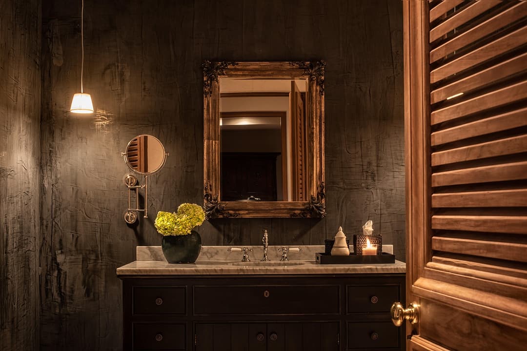 Bathroom with gold mirror and dark slate wall vanity, No. 77 Leyn Baan, Galle Fort