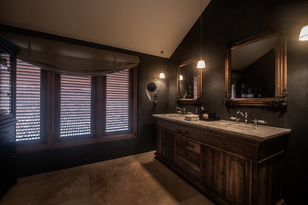 Bathroom with dark wood vanity and wall mirror, No. 77 Leyn Baan, Galle Fort, Sri Lanka