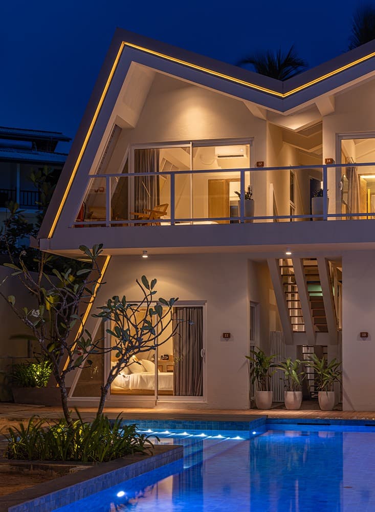 Asaya Sands Mirissa angular A-frame roof facade lit at dusk, Mirissa, Sri Lanka