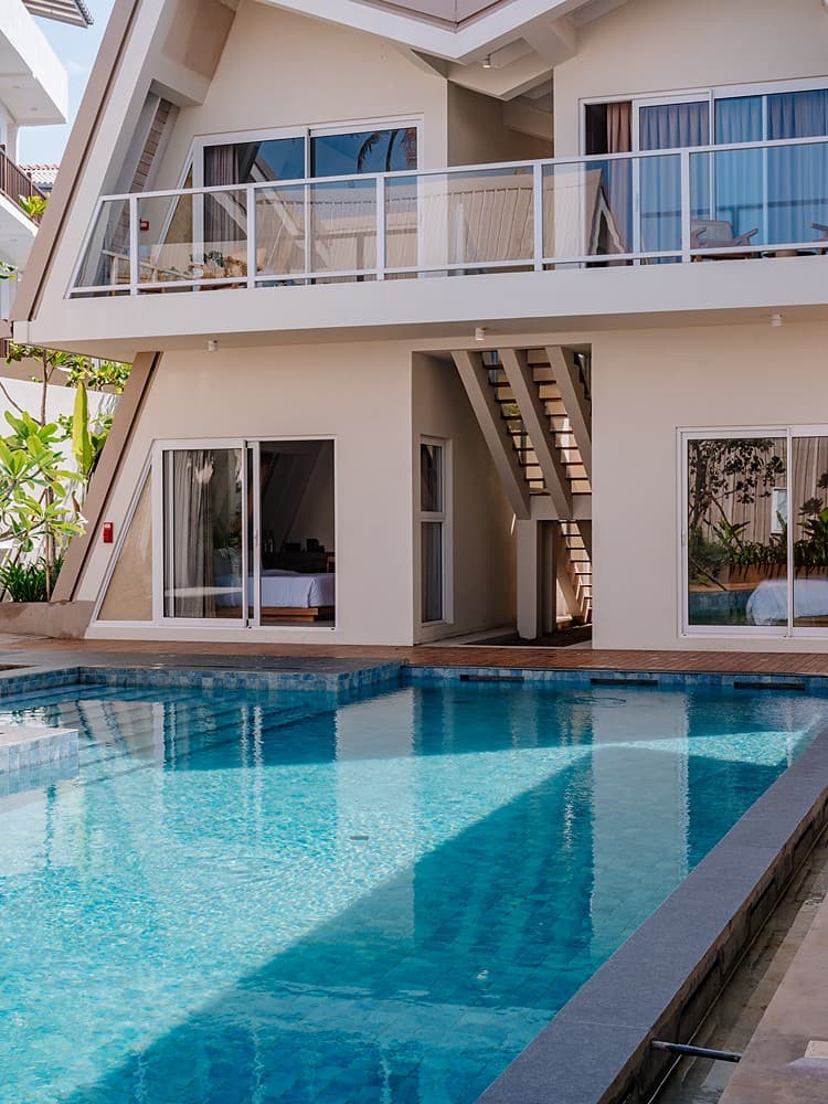 Wide daytime view of Asaya Sands Mirissa pool and A-frame chalets, Mirissa, Sri Lanka