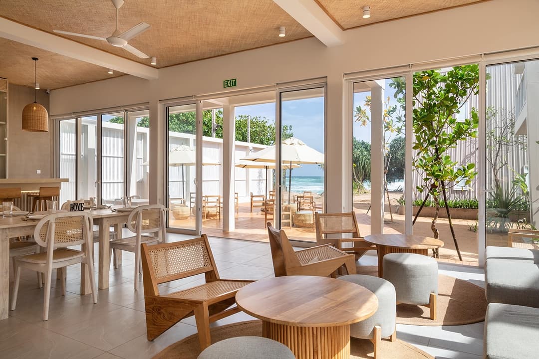 Restaurant and co-working space with timber tables and ocean view, Asaya Sands, Mirissa