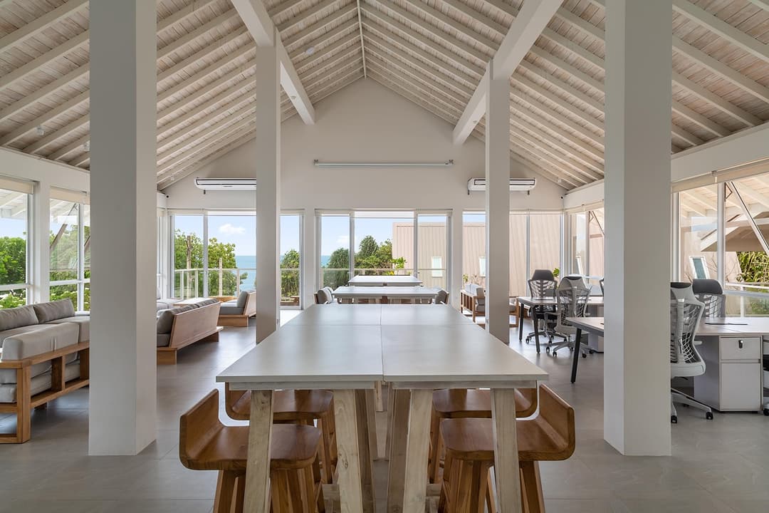 Wide dining room with white tables and high roof at Asaya Sands, Mirissa, Sri Lanka