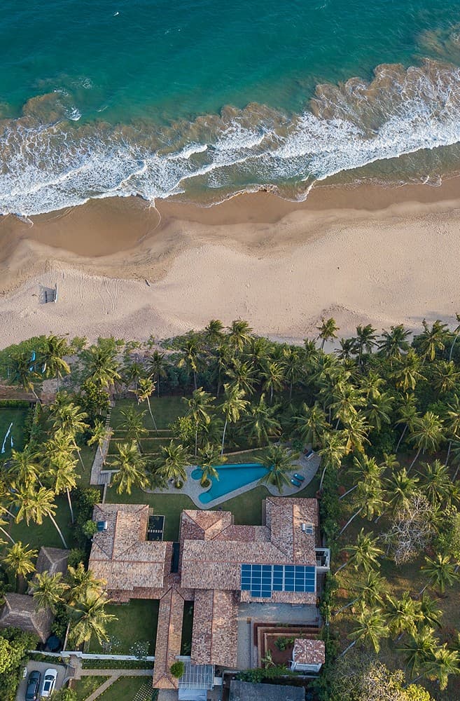 Aerial overhead of Abiman pool within dense tropical garden, Dickwella, Sri Lanka