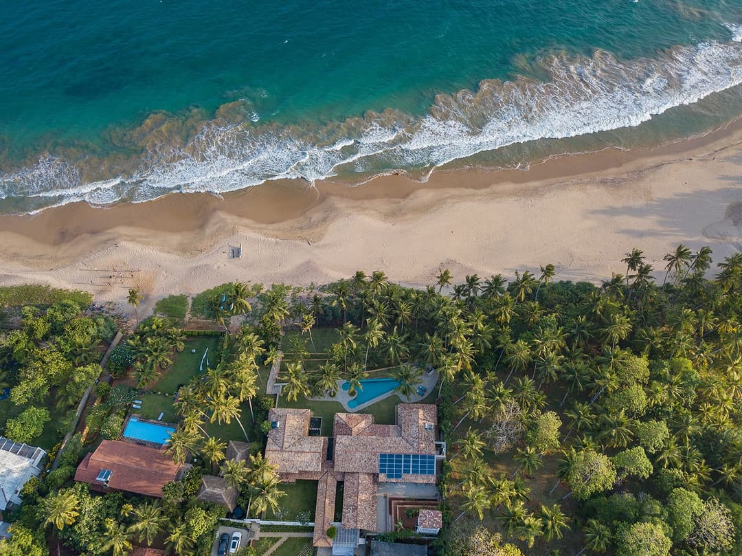 Aerial of Abiman Dickwella villa, coastline and Indian Ocean, Dickwella, Sri Lanka