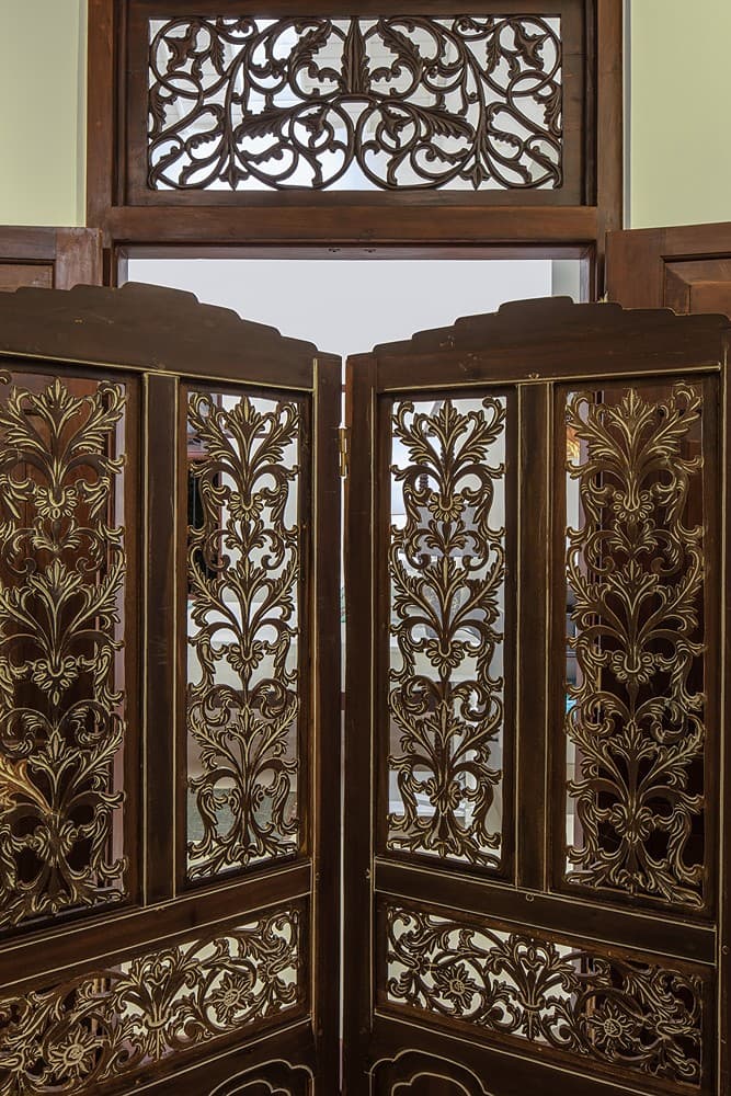 Ornate carved timber screen divider detail at Abiman, Dickwella, Sri Lanka