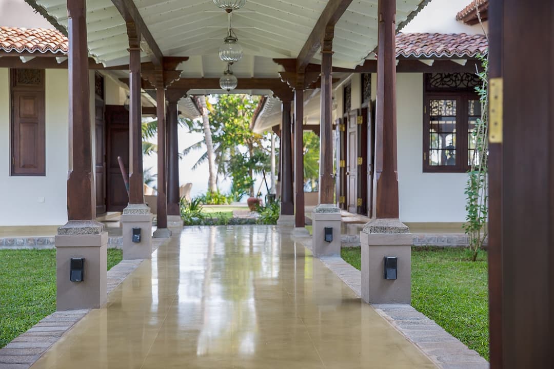 Covered colonnaded walkway between buildings at Abiman, Dickwella, Sri Lanka