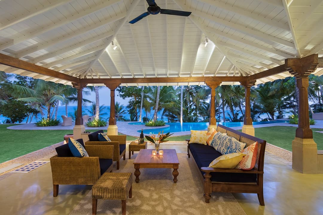 Exterior seating pavilion at dusk with cushions at Abiman, Dickwella, Sri Lanka