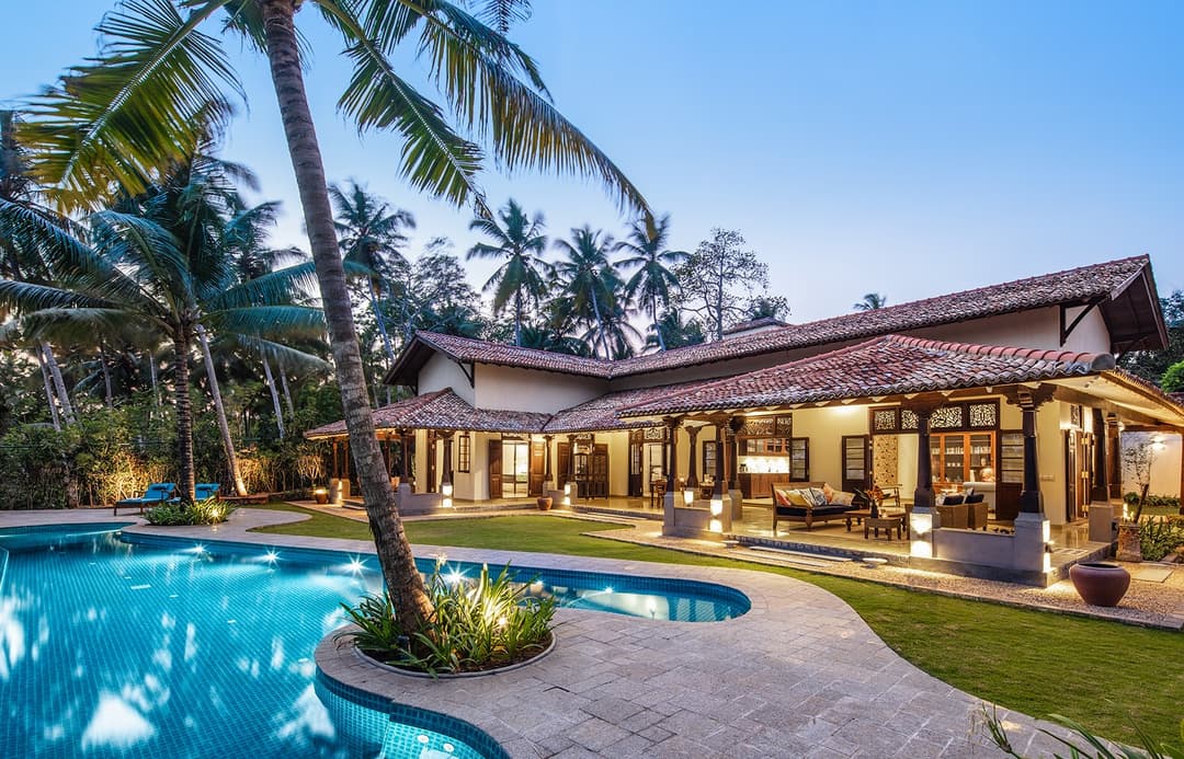 Abiman Dickwella pool and villa lit in the evening, Dickwella, Sri Lanka