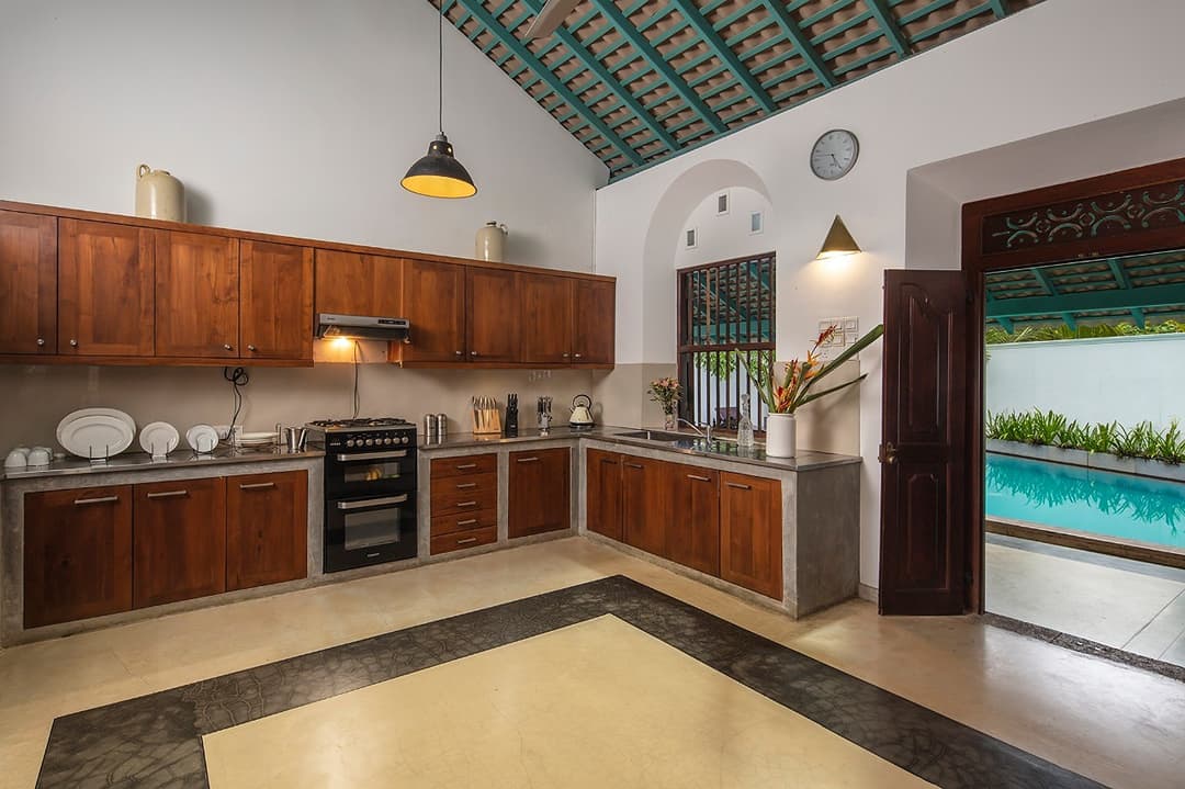 Kitchen with pool view through window, Magalla Casa Galle
