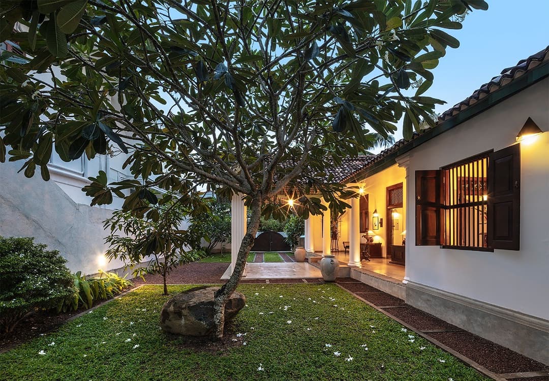 Courtyard exterior wide at dusk, Magalla Casa Galle