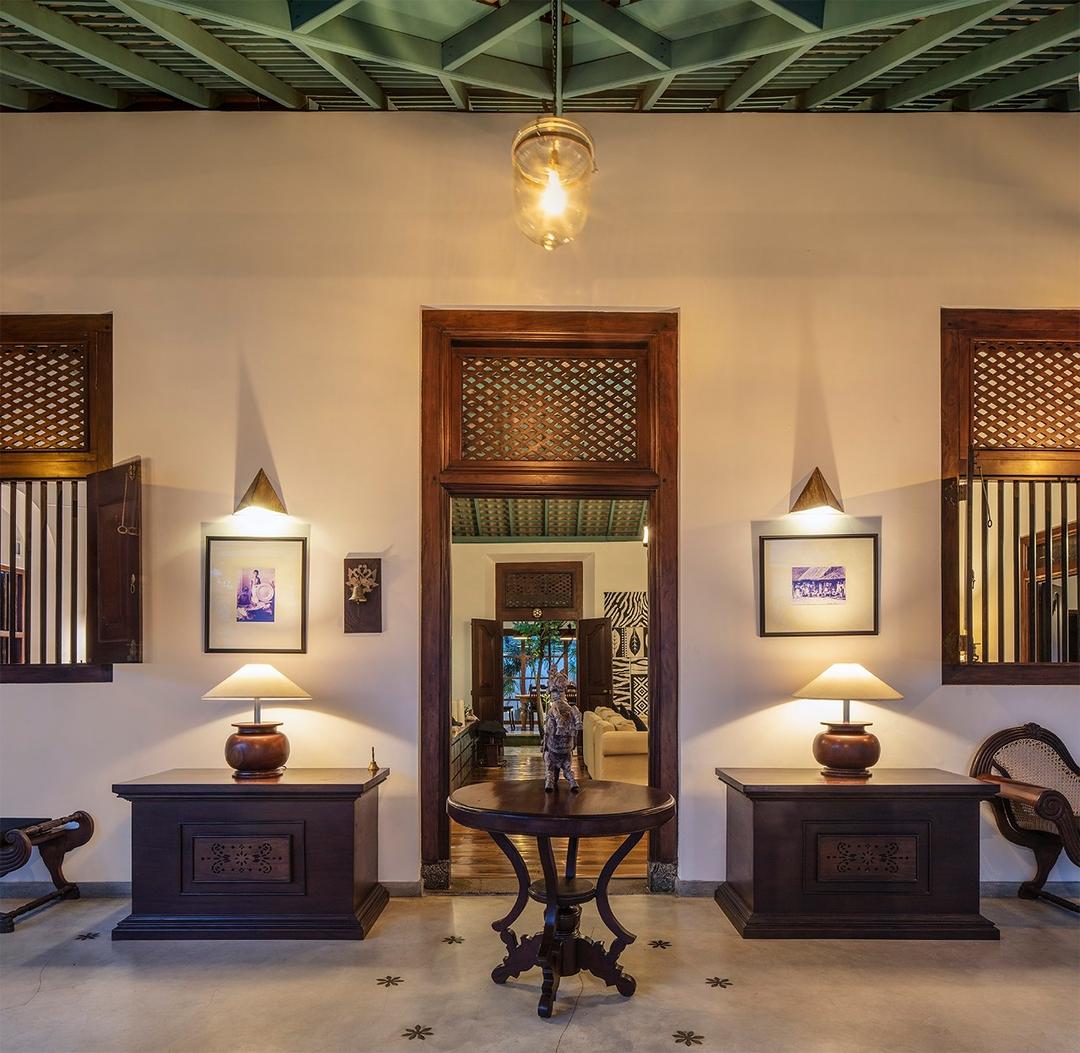 Bedroom two with antique dark wood furniture, Magalla Casa