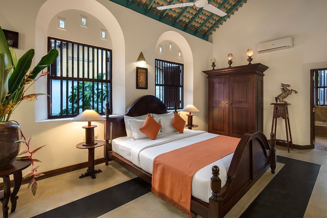 Bedroom one terracotta tones wide angle, Magalla Casa Galle
