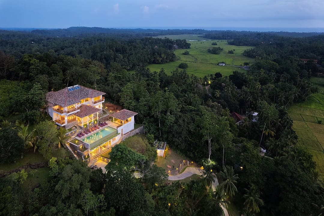 Aerial green forest setting, The Divine Villa Talpe